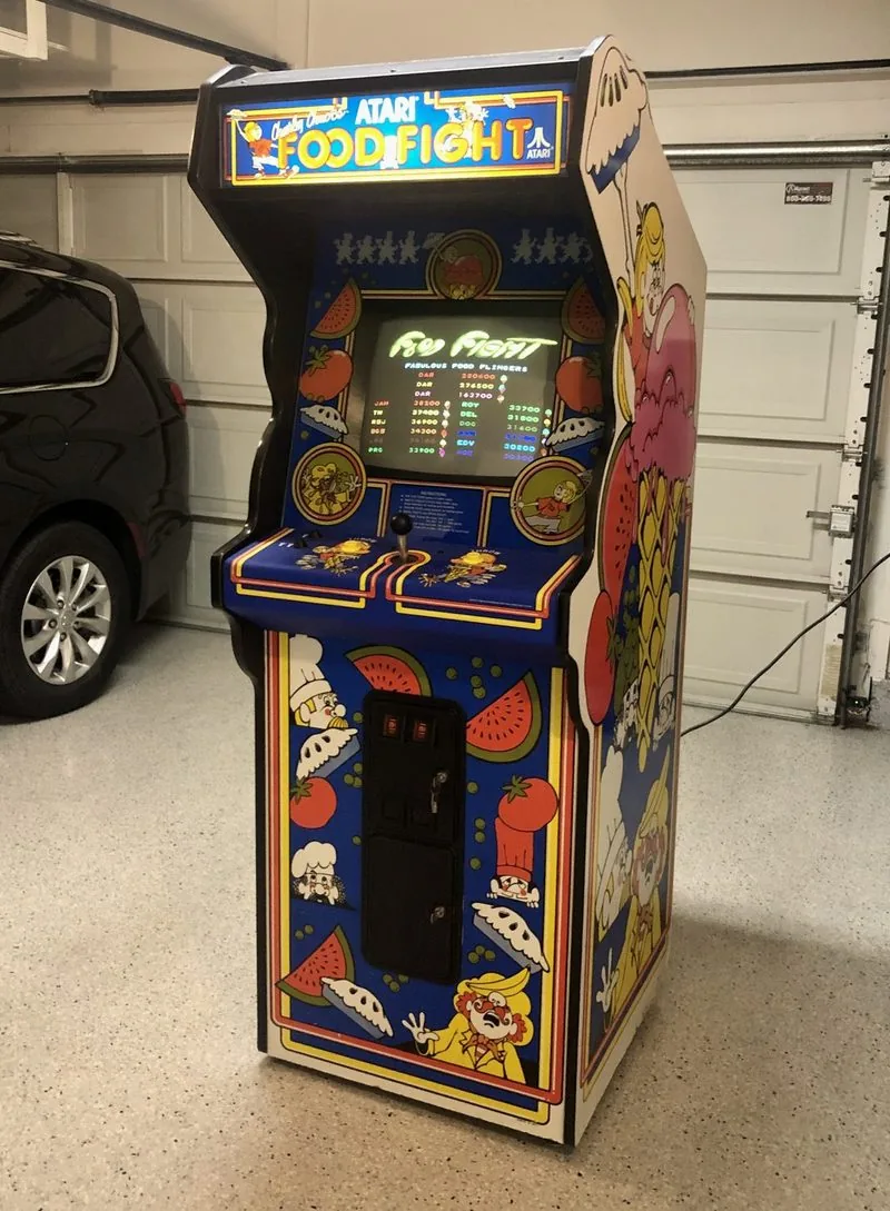 Atari Food Fight arcade cabinet with full side art, high score table on screen