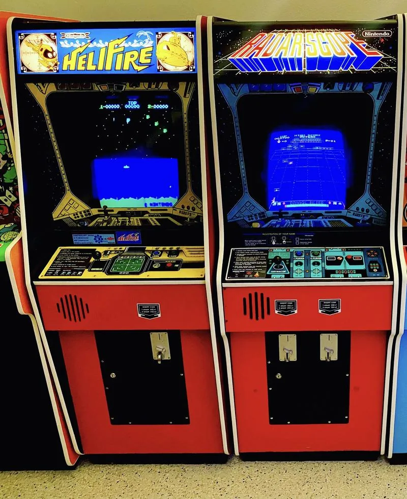 Nintendo HeliFire and Radar Scope arcade cabinets side by side