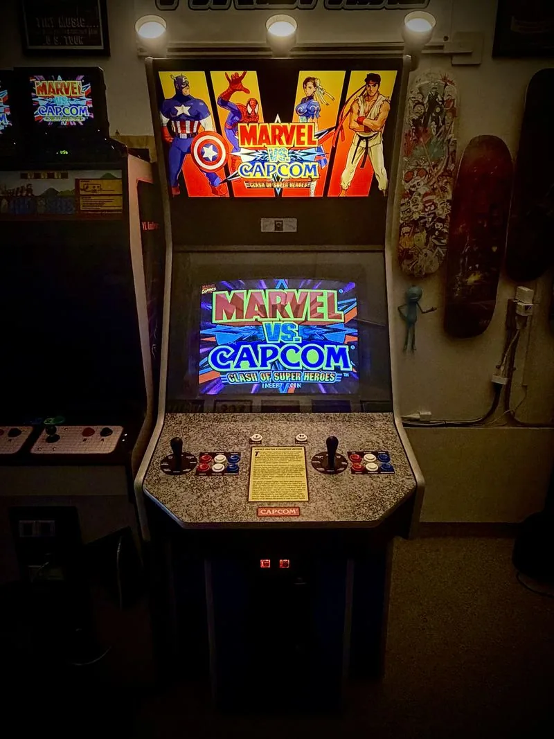 Dynamo Big Blue arcade cabinet in blue with Capcom side art and a Marvel vs. Capcom marquee