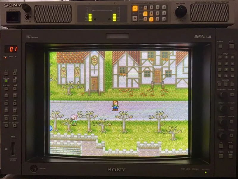 Sony BVM-A14F5U broadcast monitor with its full control panel and an AMS-100 speaker above