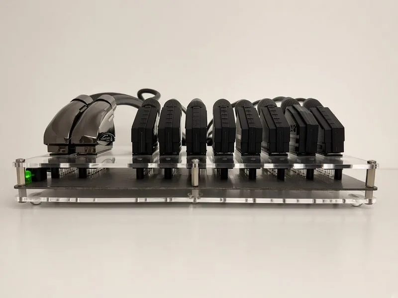 GSCART automatic SCART switch on a clear acrylic mount, eight SCART cables plugged in
