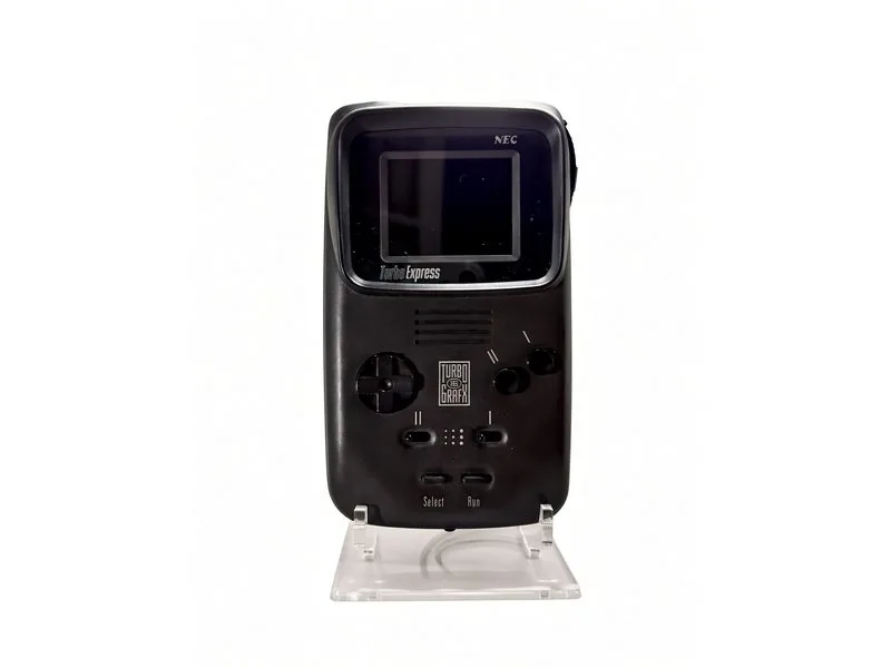 NEC Turbo Express handheld on a clear display stand, TurboGrafx-16 branding on the face