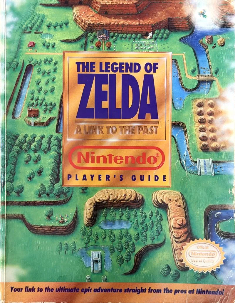 Cover of the Nintendo Player's Guide for The Legend of Zelda: A Link to the Past, the overworld drawn as a painted map