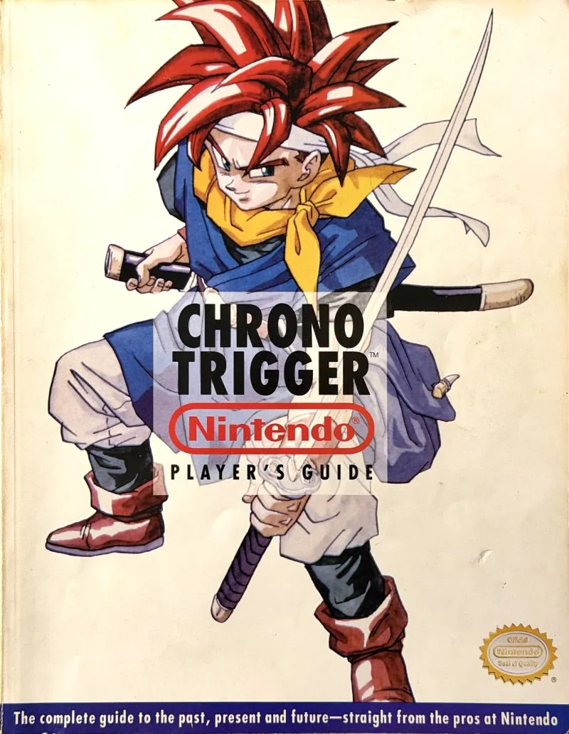 Cover of the Nintendo Player's Guide for Chrono Trigger, a red-haired swordsman on a cream field