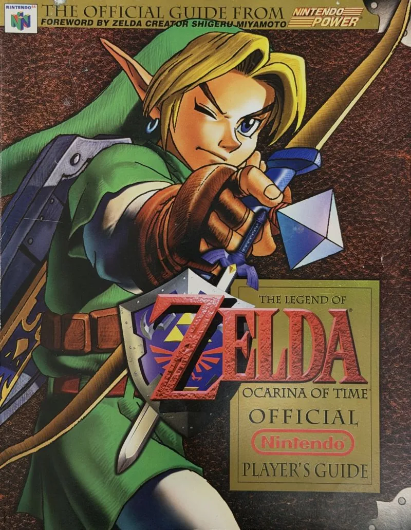 Cover of the Nintendo Player's Guide for The Legend of Zelda: Ocarina of Time, Link drawing a bow
