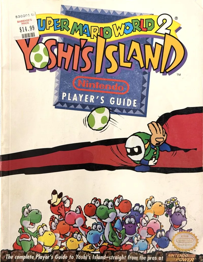 Cover of the Nintendo Player's Guide for Super Mario World 2: Yoshi's Island, a crowd of Yoshis along the bottom