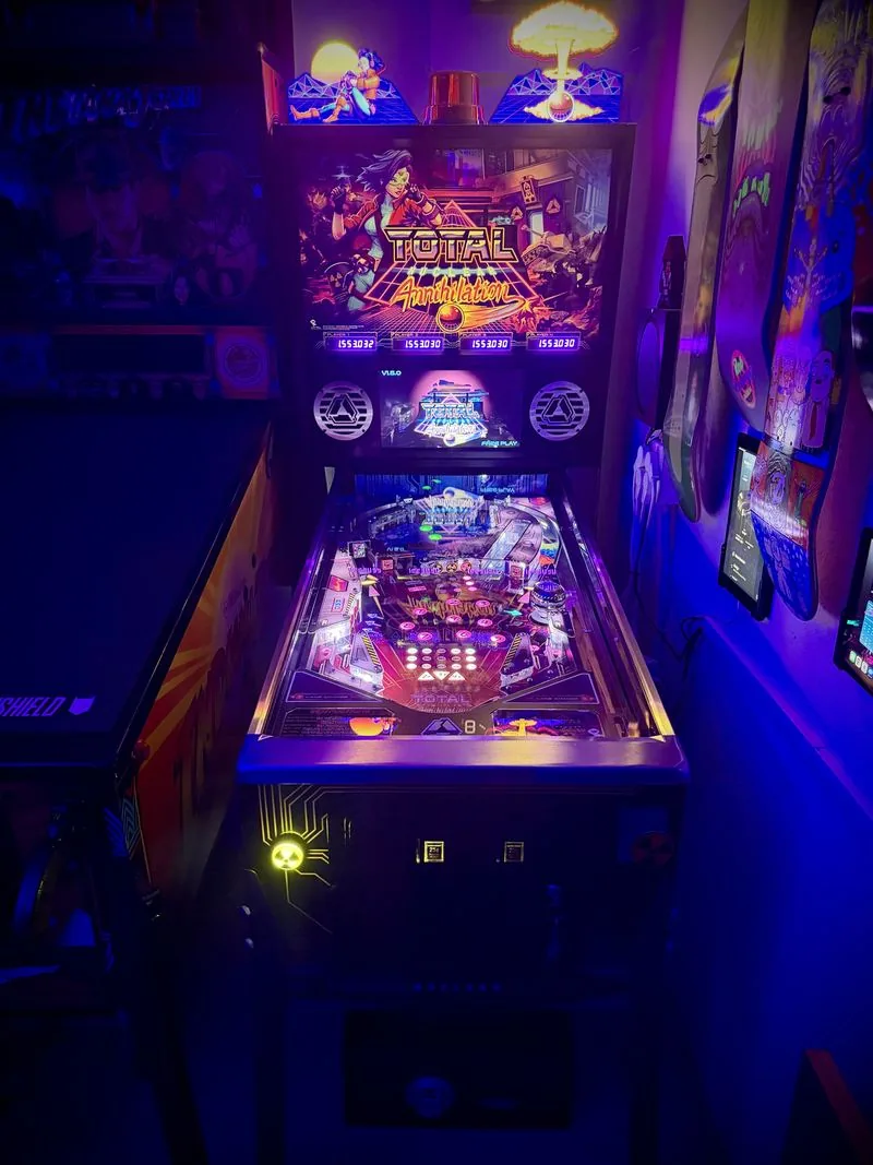 Total Nuclear Annihilation pinball machine by Spooky Pinball with its full topper set