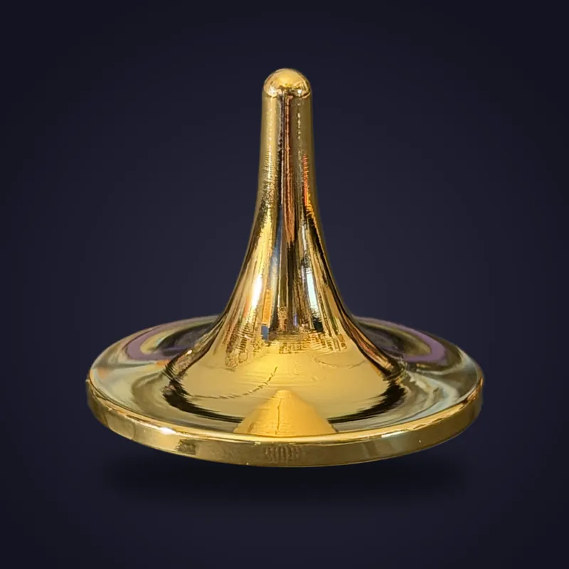 Foreverspin 24Kt Gold Mirror spinning top, photographed off its base