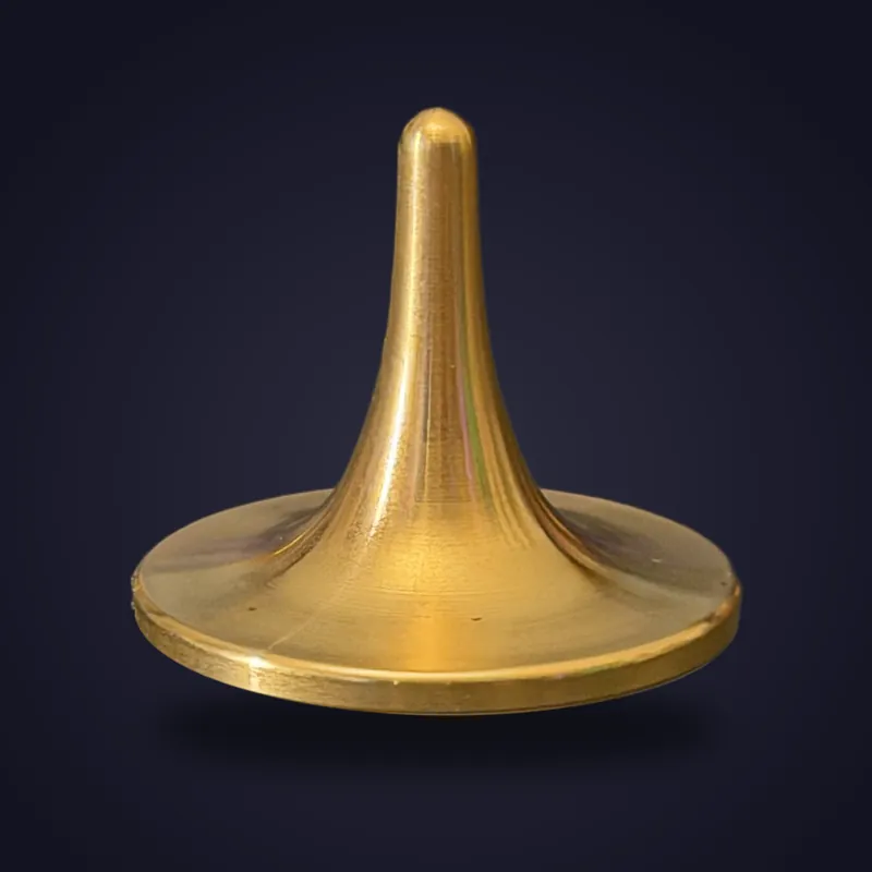 Foreverspin 24Kt Gold Plated spinning top, photographed off its base