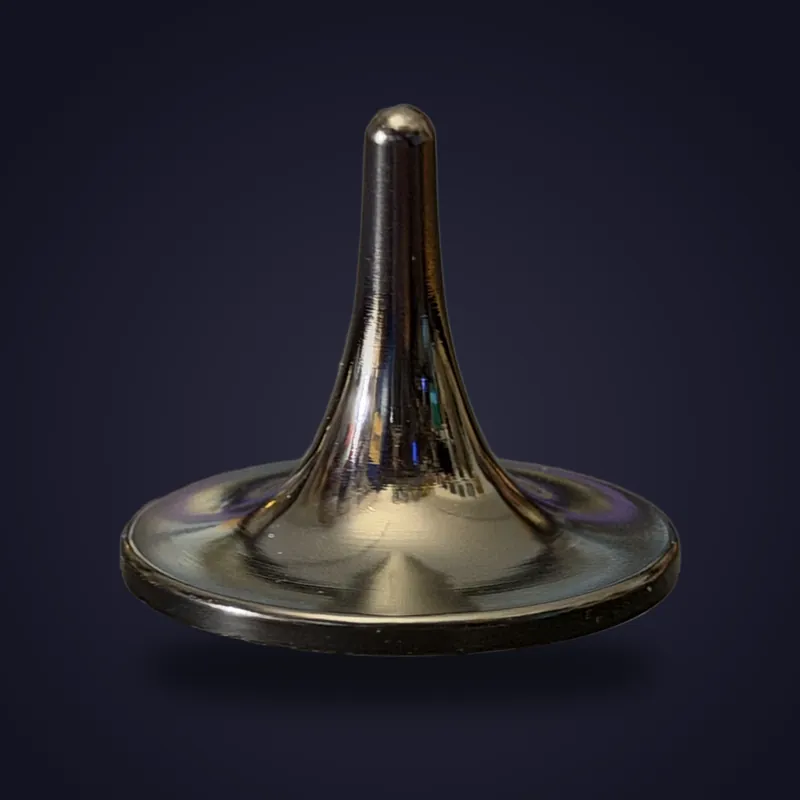 Foreverspin Black Mirror spinning top, limited edition, photographed off its base