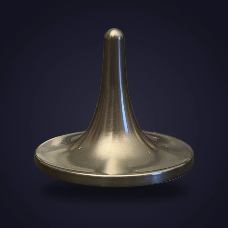 Foreverspin Black Zirconium spinning top, photographed off its base