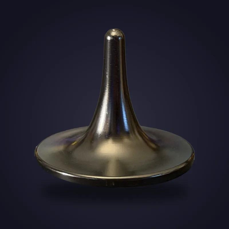 Foreverspin Black spinning top, mystery top, photographed off its base