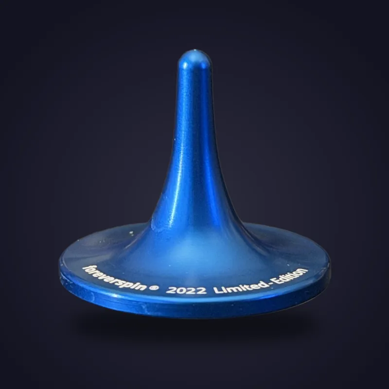 Foreverspin Blue spinning top, 2022 limited edition, photographed off its base