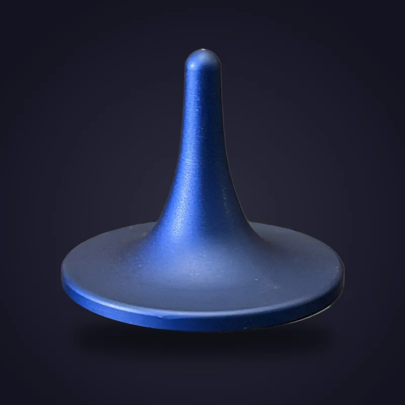 Foreverspin Blue Matte spinning top, mystery top, photographed off its base