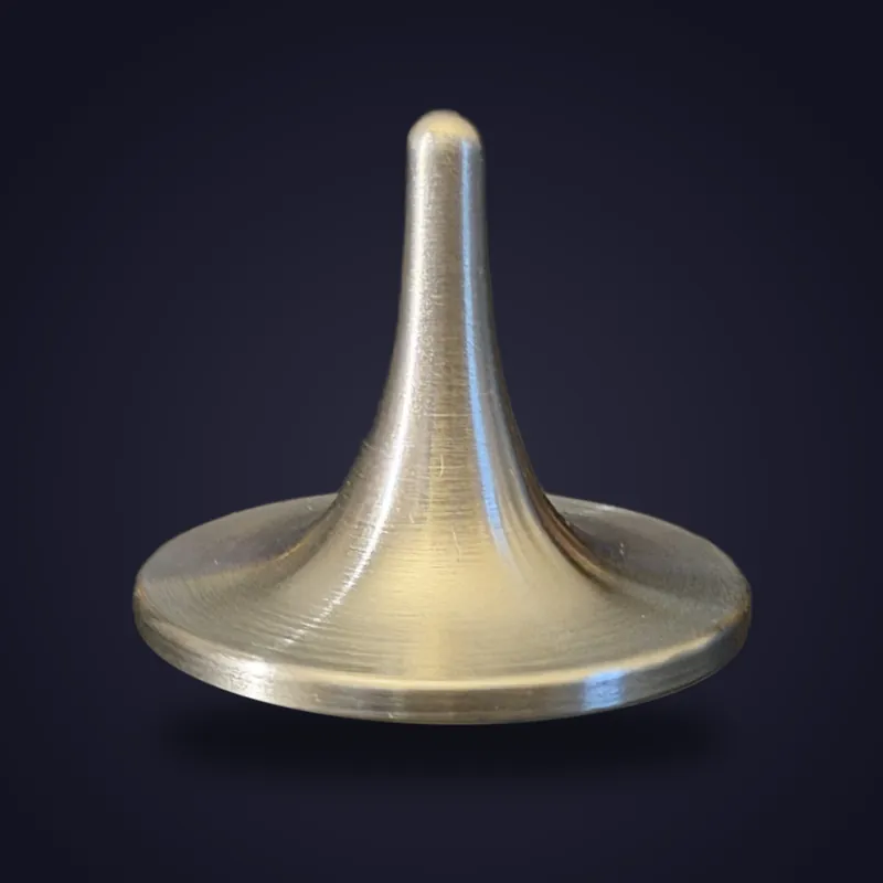 Foreverspin Cast Iron spinning top, photographed off its base