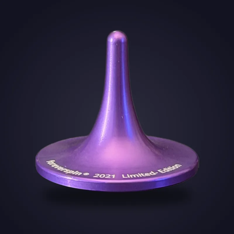 Foreverspin Indigo spinning top, 2021 limited edition, photographed off its base