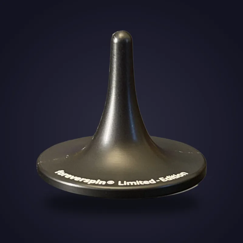 Foreverspin Matte Black spinning top, limited edition, photographed off its base