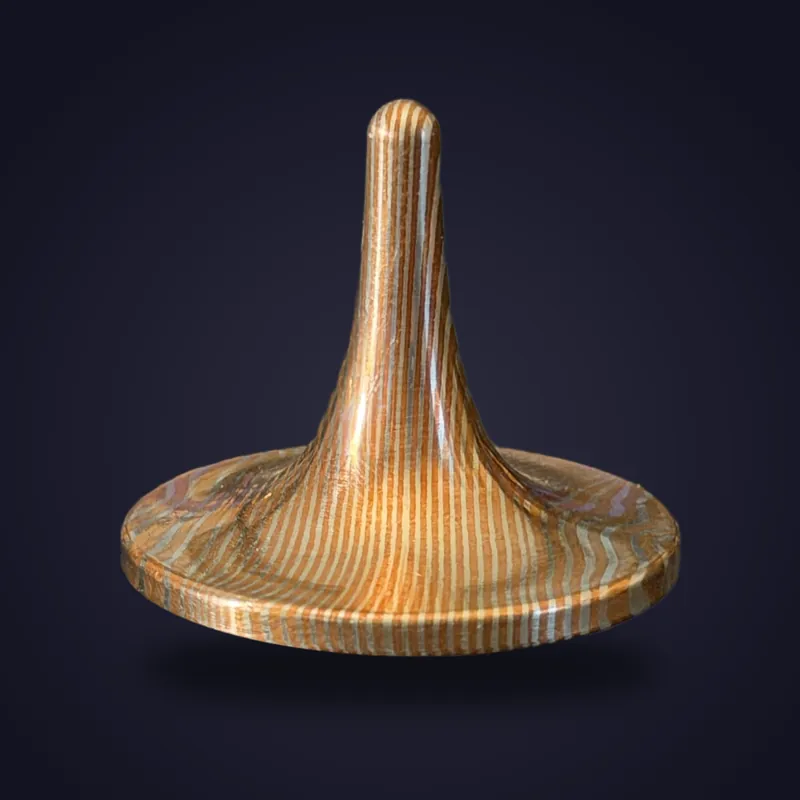 Foreverspin Mokume-Gane Copper spinning top, photographed off its base