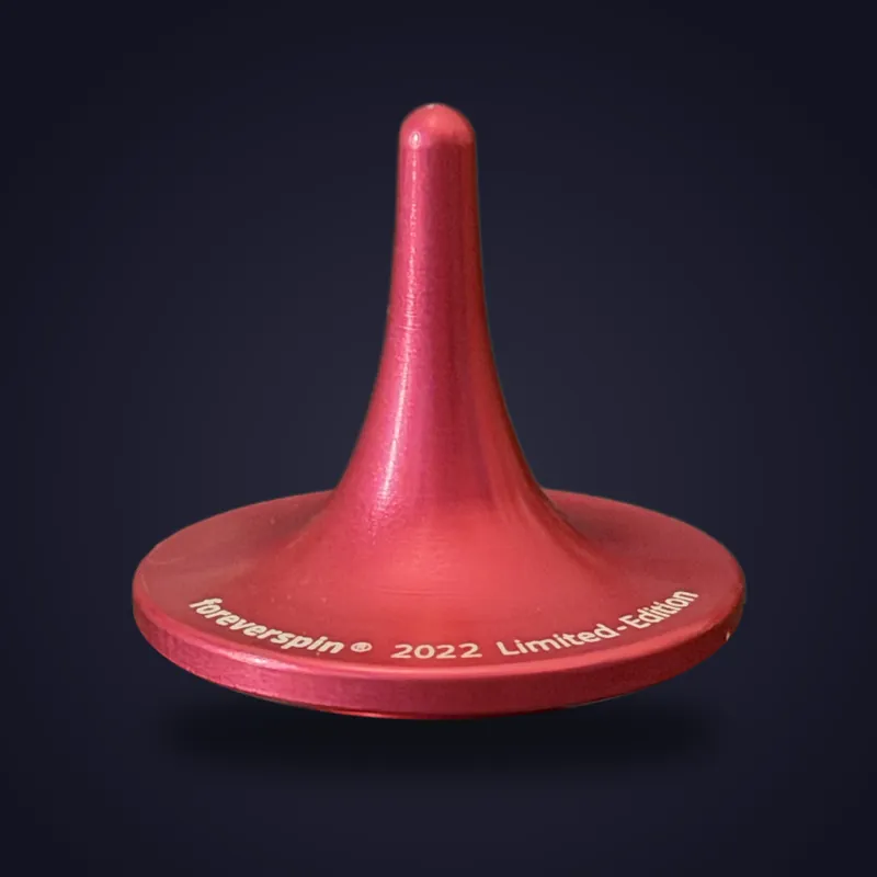 Foreverspin Pink spinning top, 2022 limited edition, photographed off its base