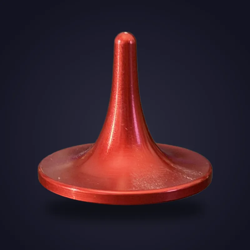 Foreverspin Red spinning top, mystery top, photographed off its base