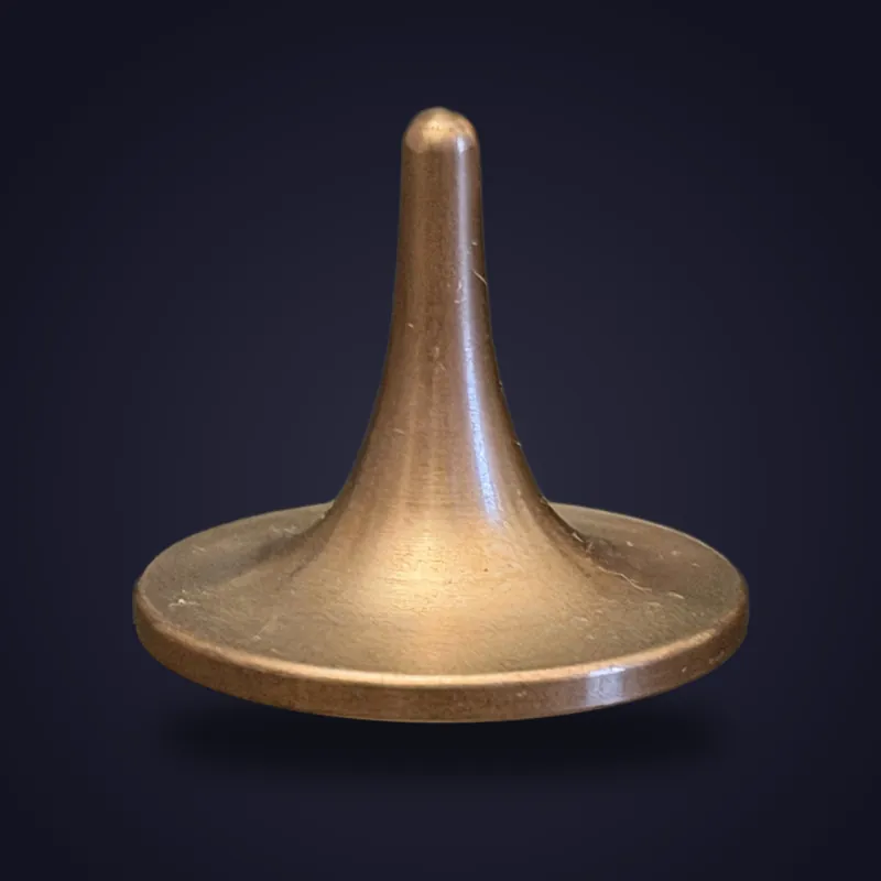 Foreverspin Rose Gold Plated spinning top, photographed off its base