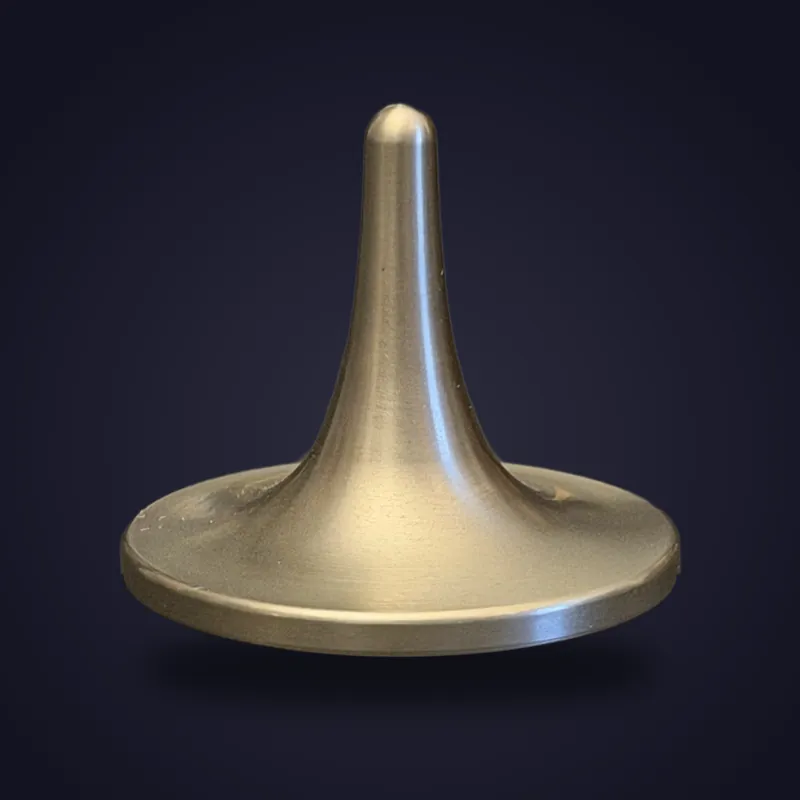 Foreverspin Titanium spinning top, photographed off its base