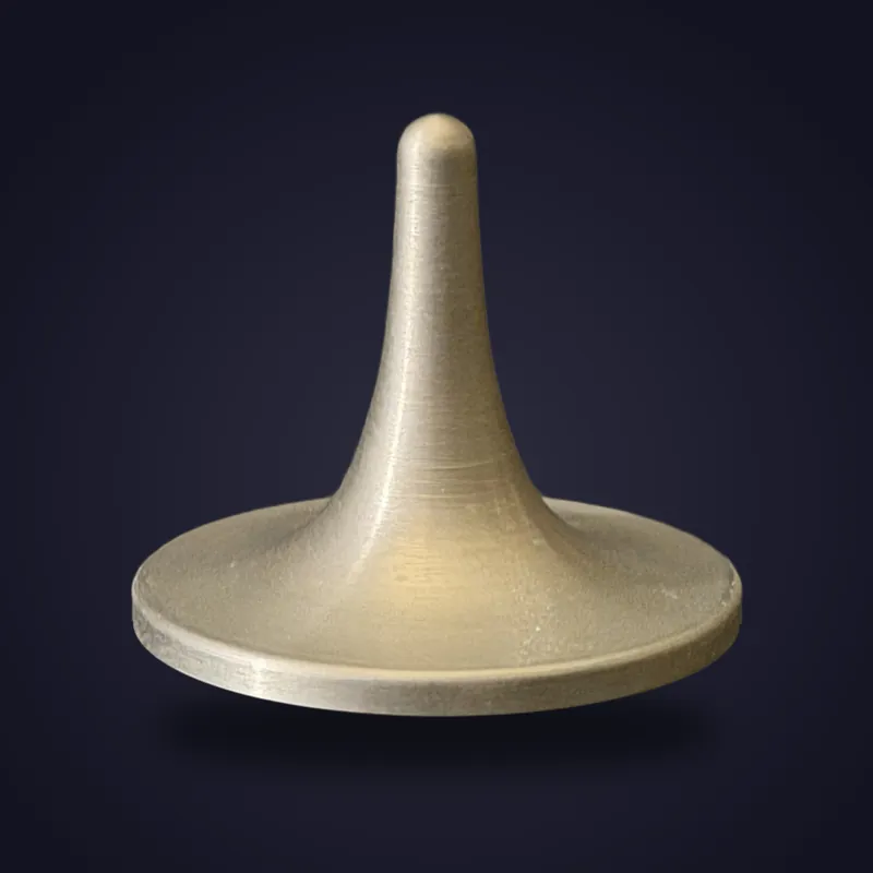 Foreverspin Tungsten spinning top, photographed off its base