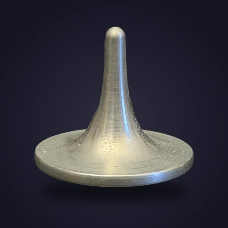 Foreverspin Zinc spinning top, photographed off its base