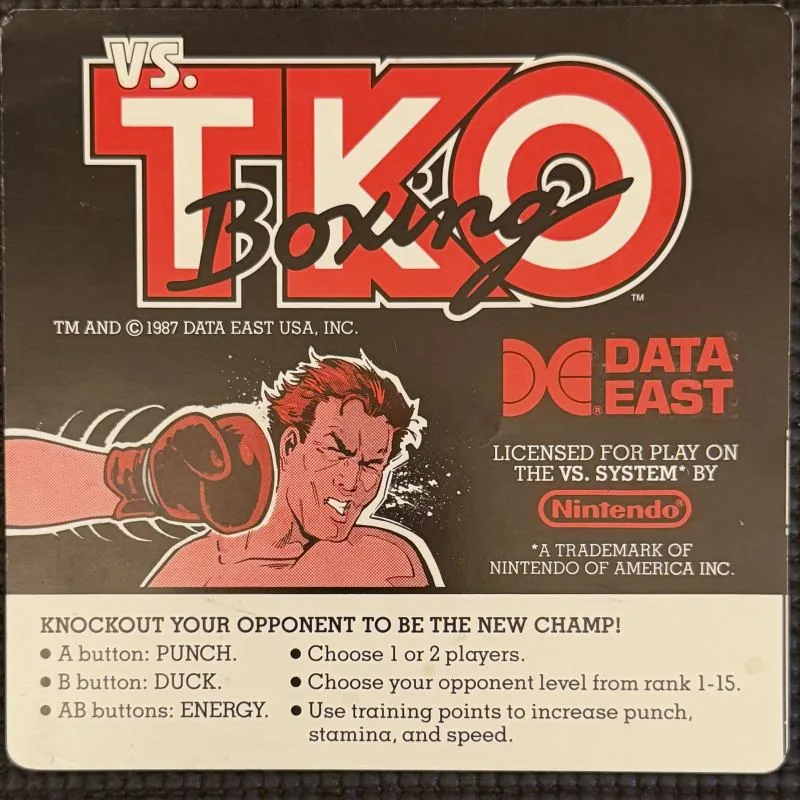 Nintendo VS. T.K.O. Boxing instruction card, black, with the Data East logo and a boxer illustration